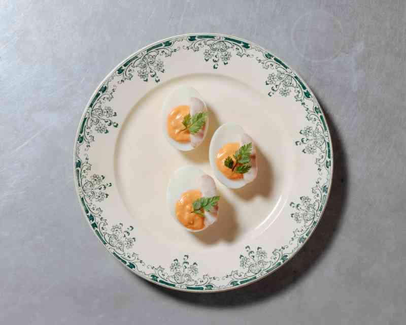 Smoked eel devilled eggs, from the “Snacks” menu